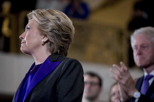 Democratic presidential candidate Hillary Clinton, left, accompanied by her husband, former President Bill Clinton, pauses while speaking at the New Yorker Hotel in New York, Wednesday, Nov. 9, 2016, where she conceded her defeat to Republican Donald Trump after the hard-fought presidential election. (AP Photo/Andrew Harnik)